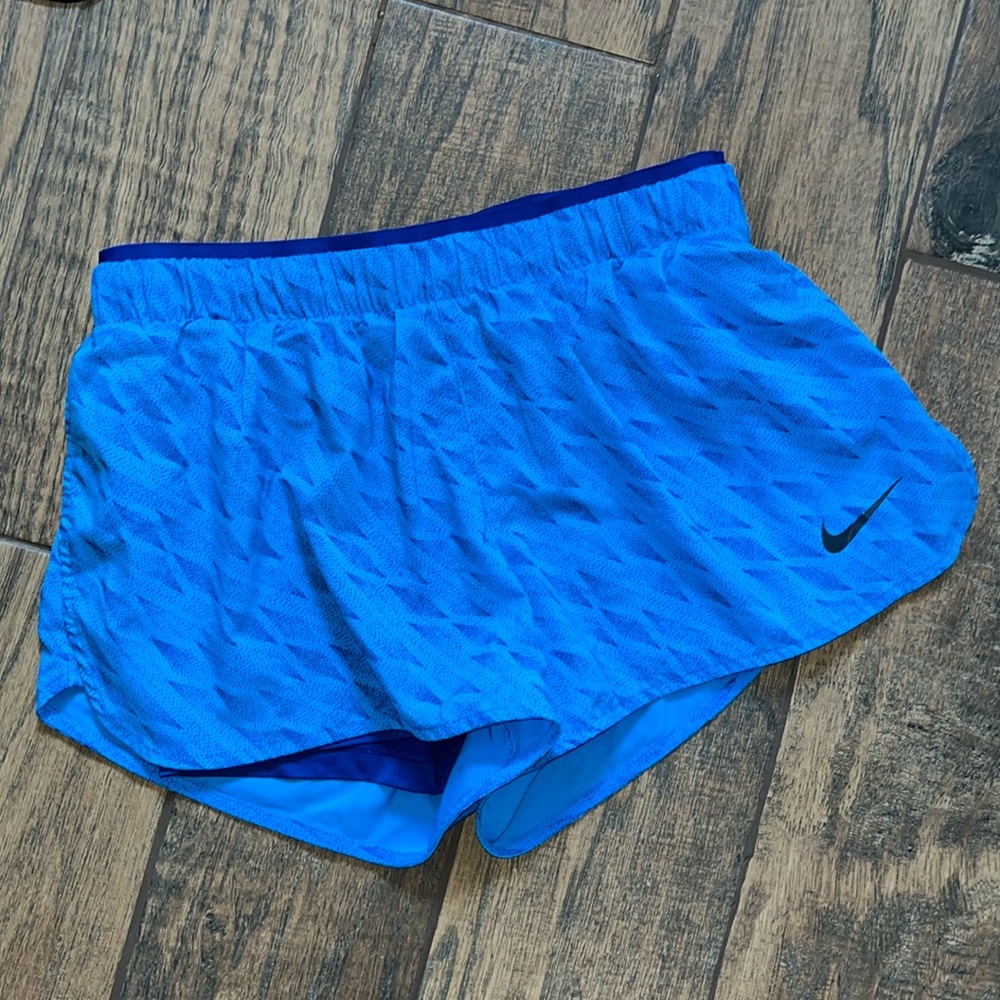Blue Nike running shorts